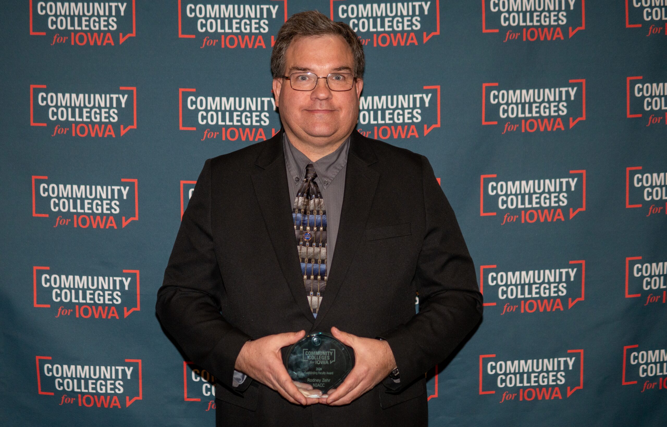 Rodney Zehr Holding Trophy