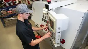 Photo of student working machinery in Tool & Die program