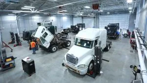 Photo of students working on trucks in the Diesel Technology Center