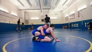Photo of student athletes in the wrestling room