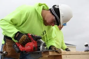 Picture of Building Trades student cutting lumber