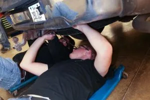 Picture of Automotive students working on car