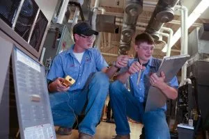 Picture of students working on HVAC unit